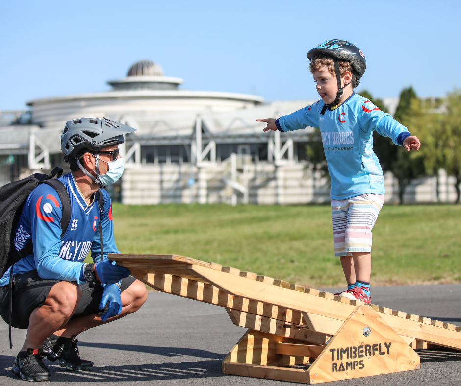 Young rider walking over the Seesaw ramp.